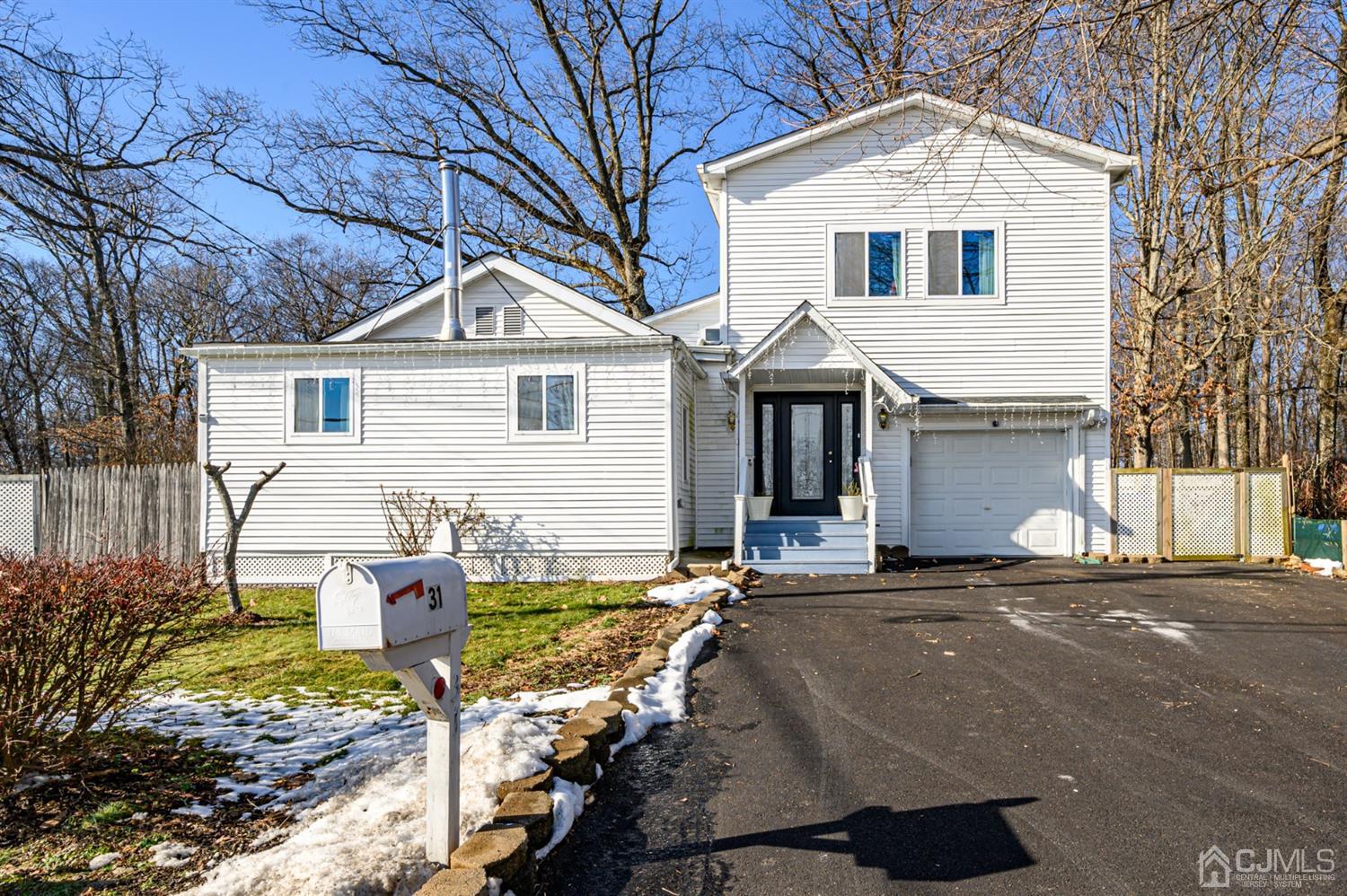 31 Parker Road Long Valley, NJ 07853 - Photo 1 of 46 a front view of a house with a yard