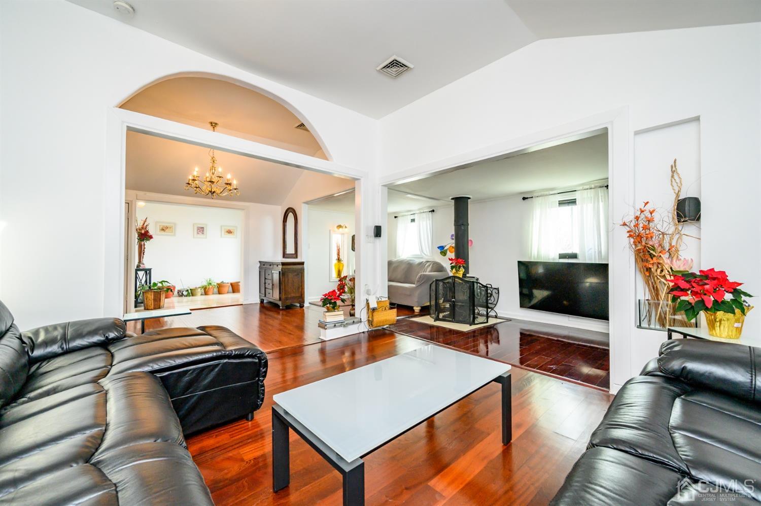 31 Parker Road Long Valley, NJ 07853 - Photo 11 of 46 a living room with furniture kitchen view and a flat screen tv