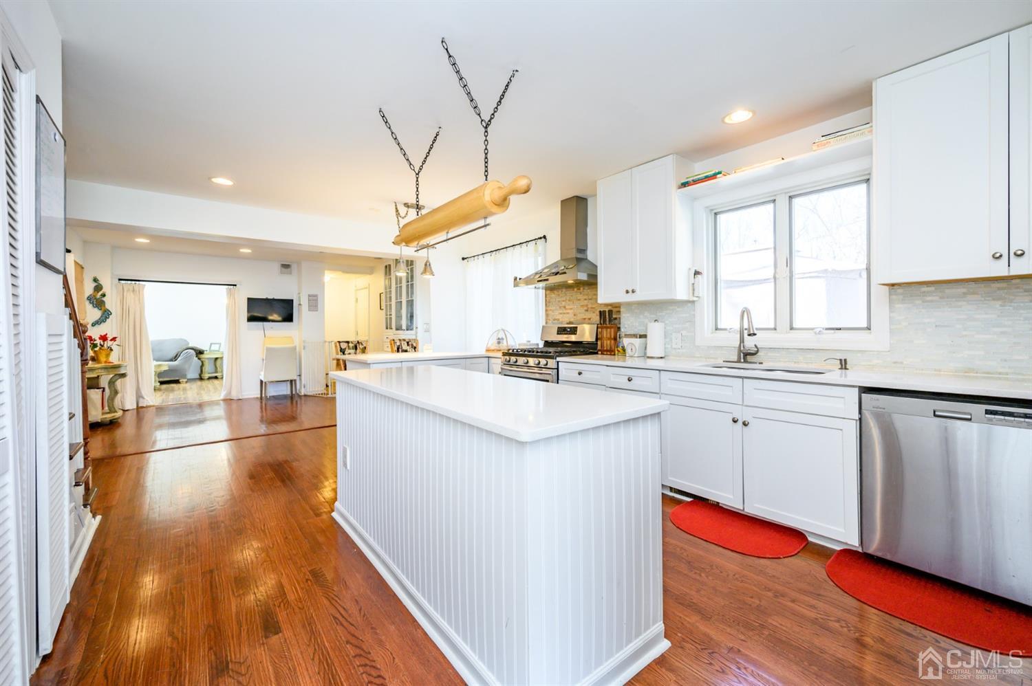 31 Parker Road Long Valley, NJ 07853 - Photo 15 of 46 a kitchen with stainless steel appliances granite countertop a lot of counter space and wooden floors
