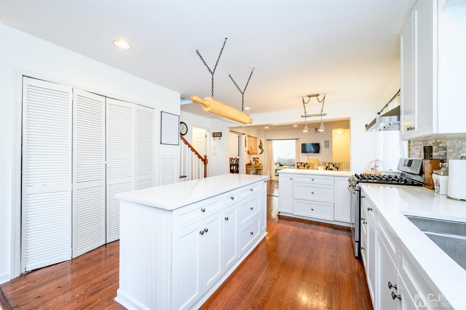 31 Parker Road Long Valley, NJ 07853 - Photo 16 of 46 a large kitchen with kitchen island white cabinets and stainless steel appliances