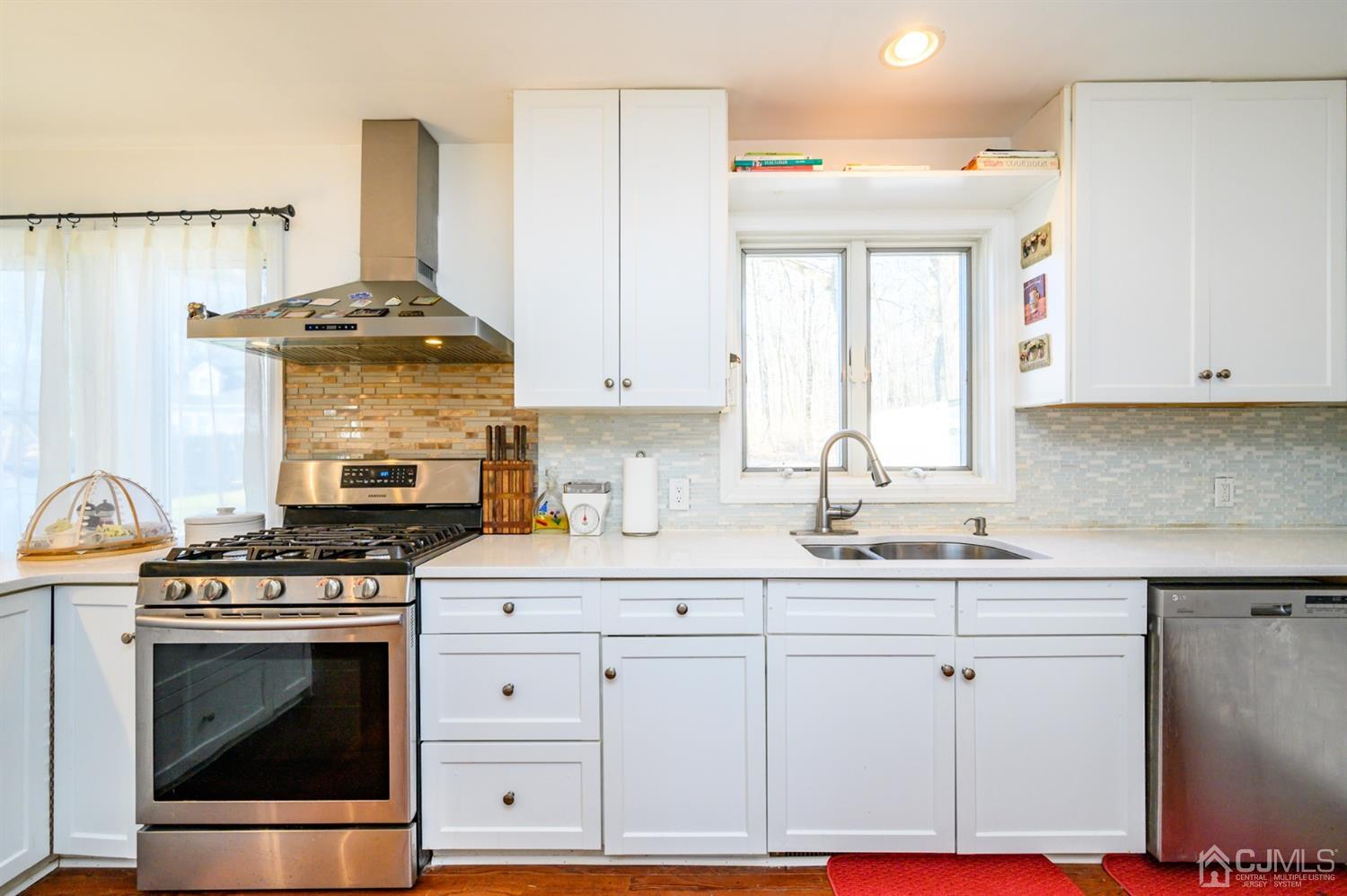 31 Parker Road Long Valley, NJ 07853 - Photo 18 of 46 a kitchen with granite countertop white cabinets and white appliances
