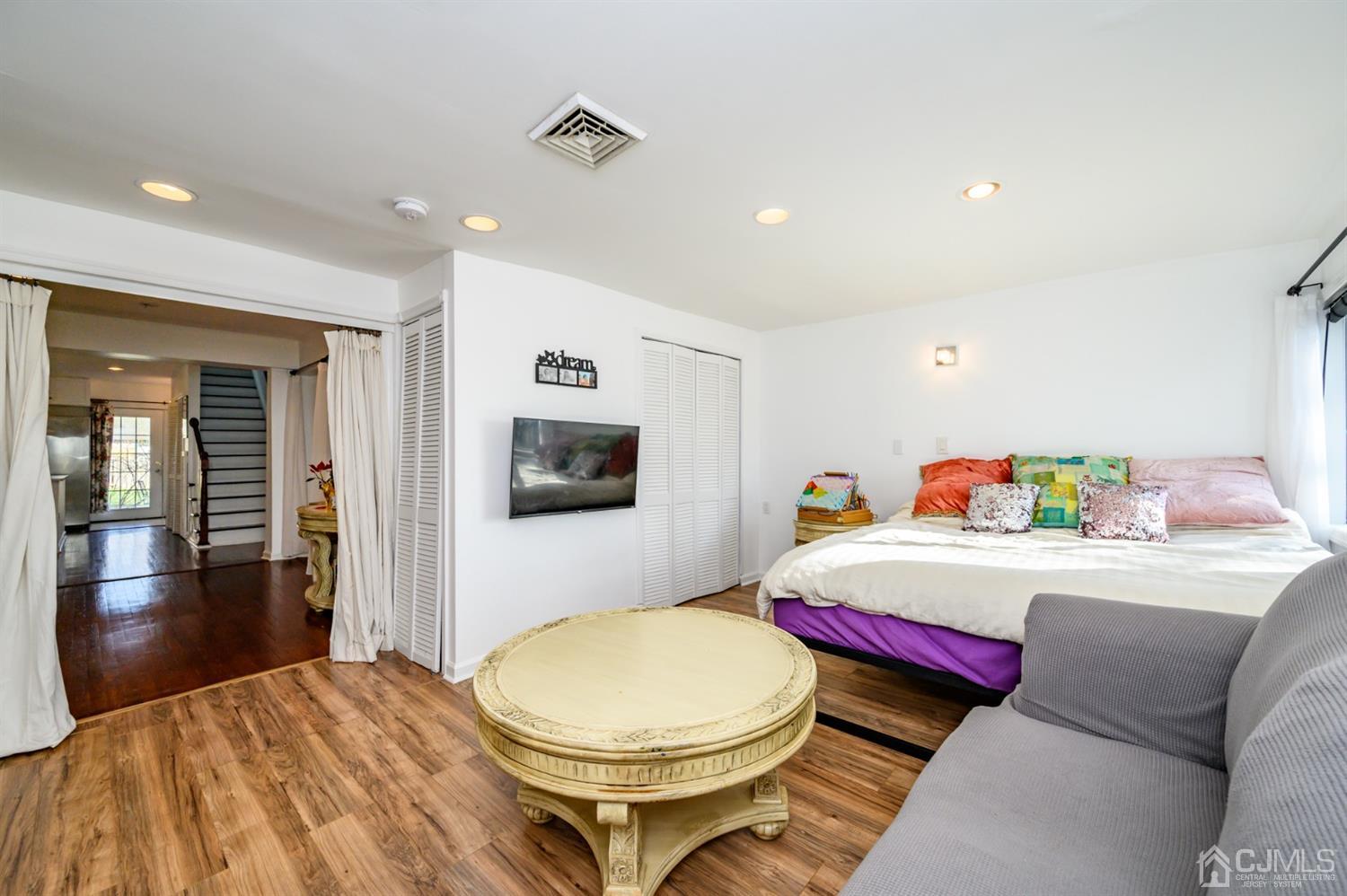 31 Parker Road Long Valley, NJ 07853 - Photo 24 of 46 a room with a bed and a flat screen tv