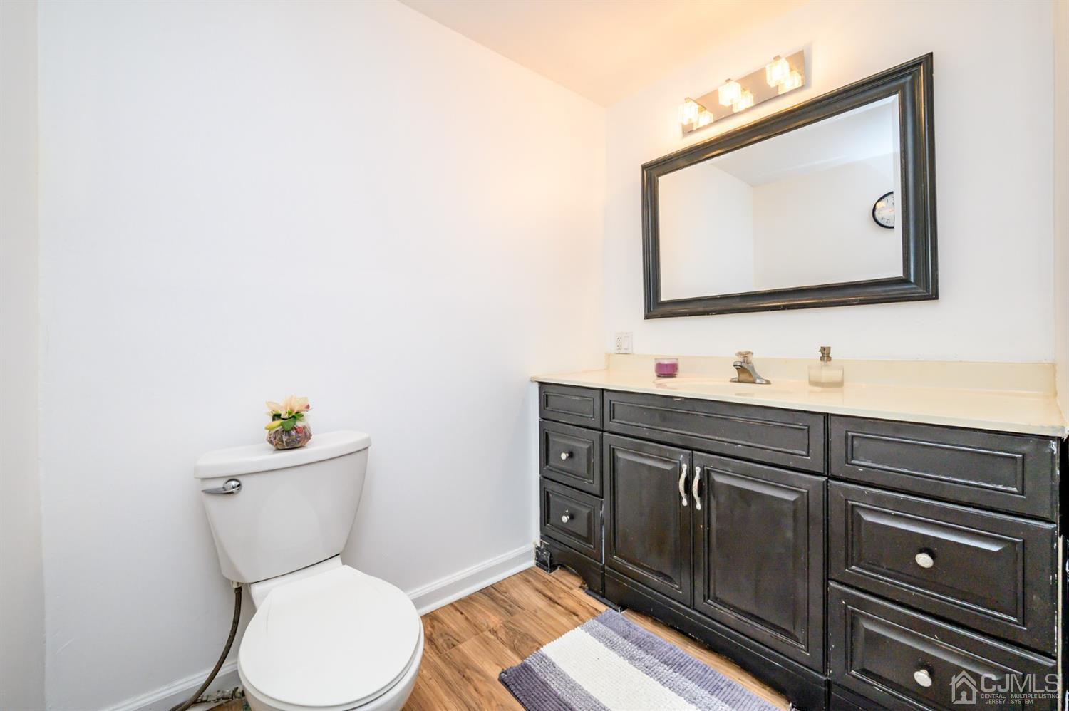31 Parker Road Long Valley, NJ 07853 - Photo 25 of 46 a bathroom with a toilet a sink and mirror