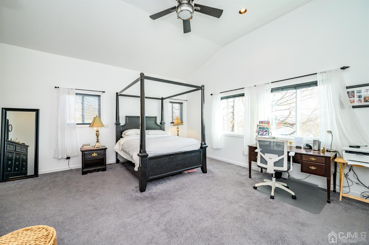 31 Parker Road Long Valley, NJ 07853 - Photo 31 of 46 a bedroom with a bed and a chandelier