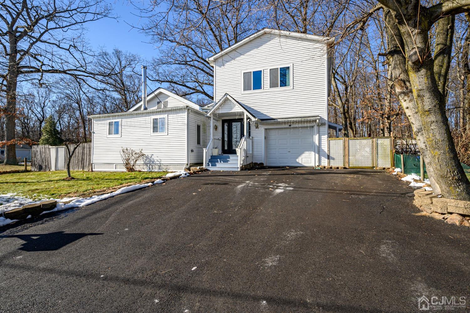 31 Parker Road Long Valley, NJ 07853 - Photo 46 of 46 a view of a white house with a big yard and large tree