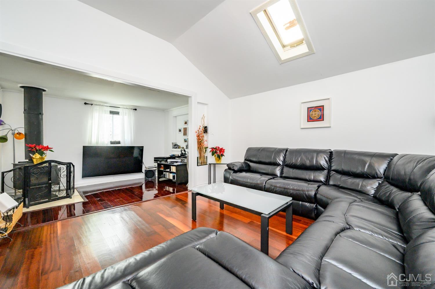 31 Parker Road Long Valley, NJ 07853 - Photo 10 of 46 a living room with furniture and a flat screen tv