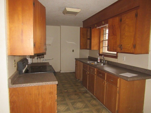 78 Holly Pl Road Marble, NC 28905 - Photo 12 of 27 a kitchen with a sink and a stove top oven