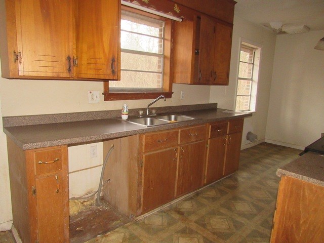 78 Holly Pl Road Marble, NC 28905 - Photo 25 of 27 a kitchen with stainless steel appliances granite countertop a sink a stove cabinets and a window