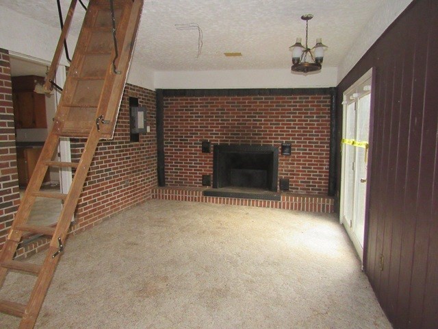 78 Holly Pl Road Marble, NC 28905 - Photo 10 of 27 a view of empty room with fireplace and windows