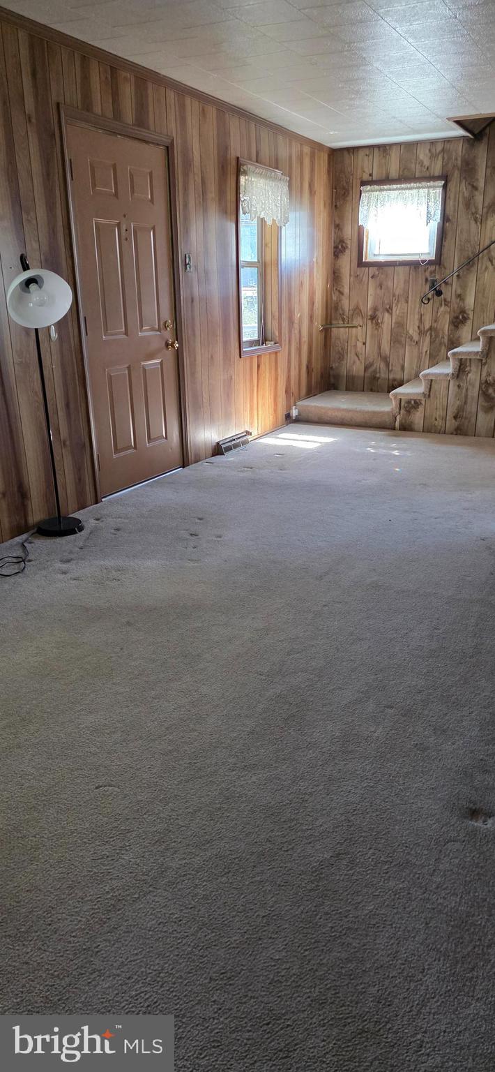 12603 Ellerslie Road Northwest Corriganville, MD 21502 - Photo 13 of 25 a view of an empty room with wooden floor and a window