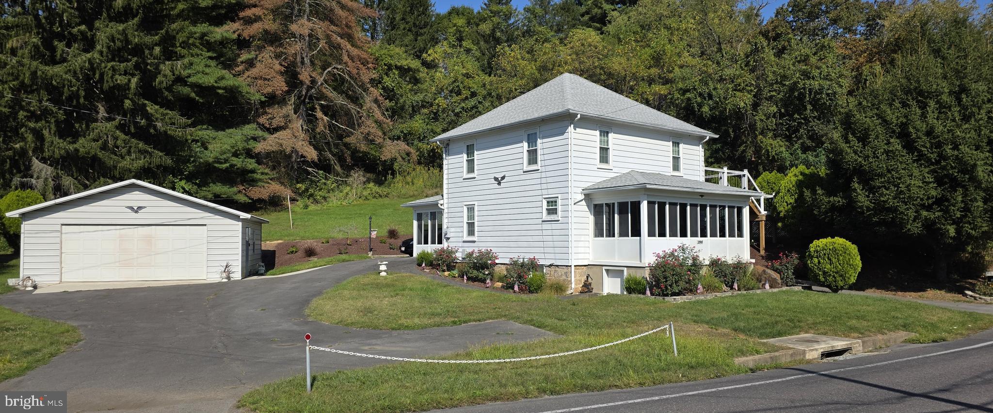 12603 Ellerslie Road Northwest Corriganville, MD 21502 - Photo 2 of 25 a front view of a house with a yard and garage