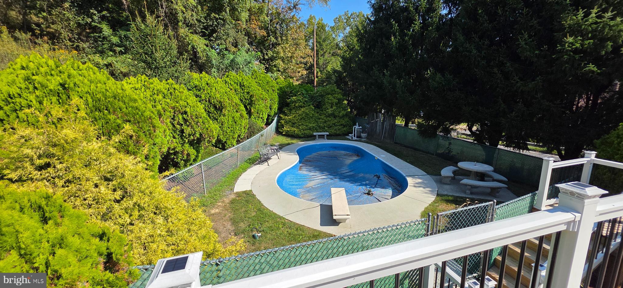 12603 Ellerslie Road Northwest Corriganville, MD 21502 - Photo 6 of 25 a view of a chair and table in the balcony