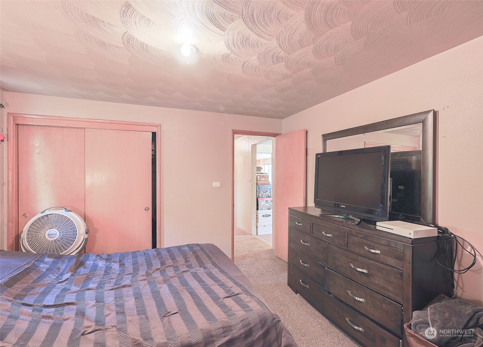 11120 Ohop Valley-Extension Road East Eatonville, WA 98328 - Photo 13 of 32 a bedroom with a bed and a flat screen tv