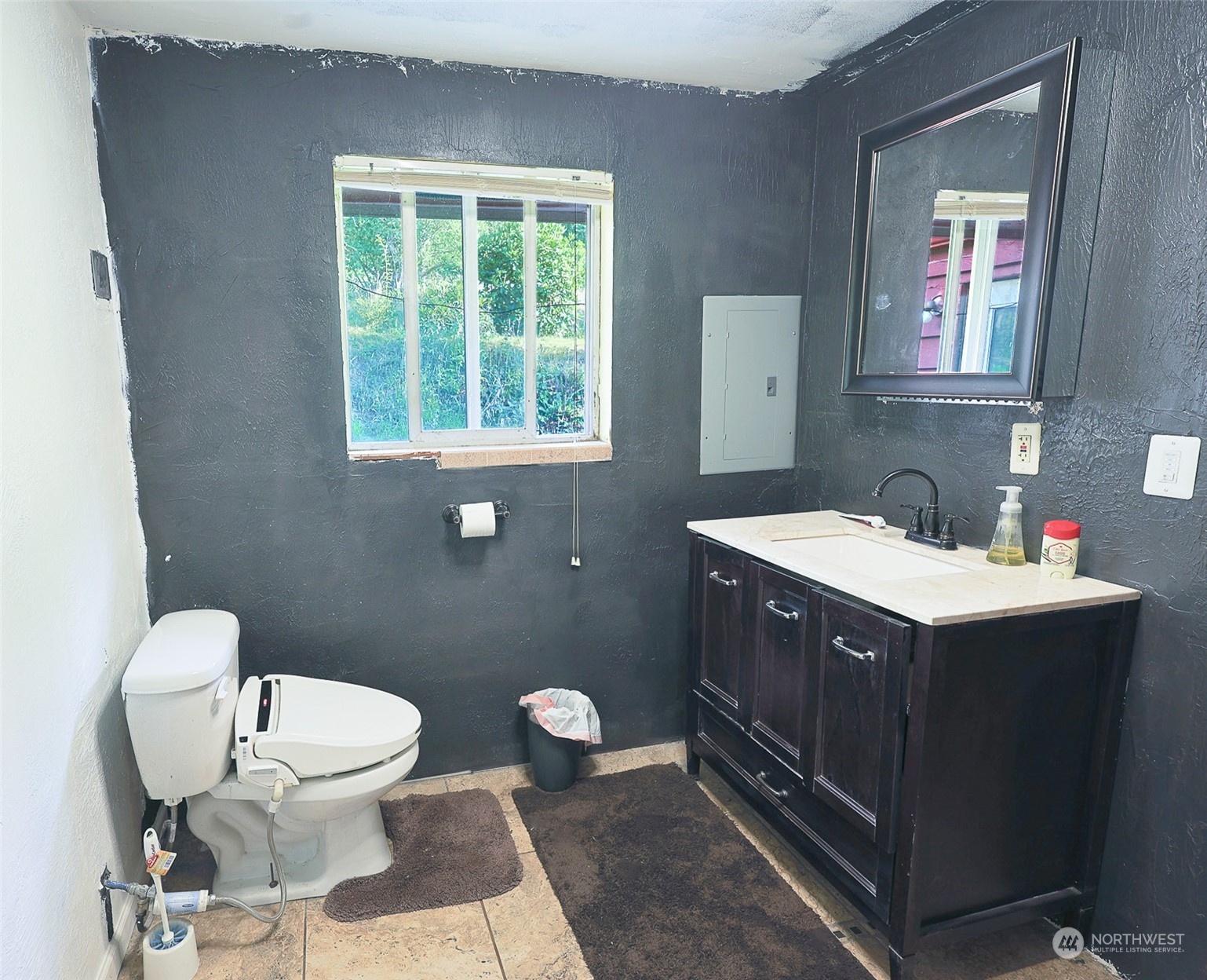 11120 Ohop Valley-Extension Road East Eatonville, WA 98328 - Photo 14 of 32 a bathroom with a sink vanity mirror and toilet