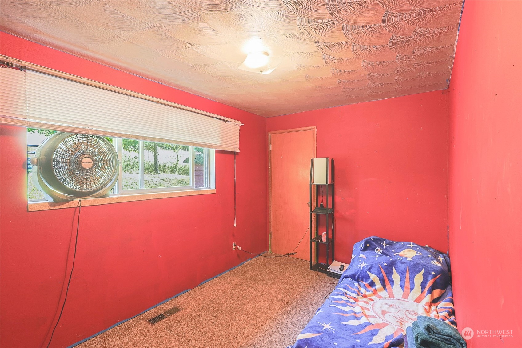 11120 Ohop Valley-Extension Road East Eatonville, WA 98328 - Photo 16 of 32 a bedroom with a bed and a painting on the wall