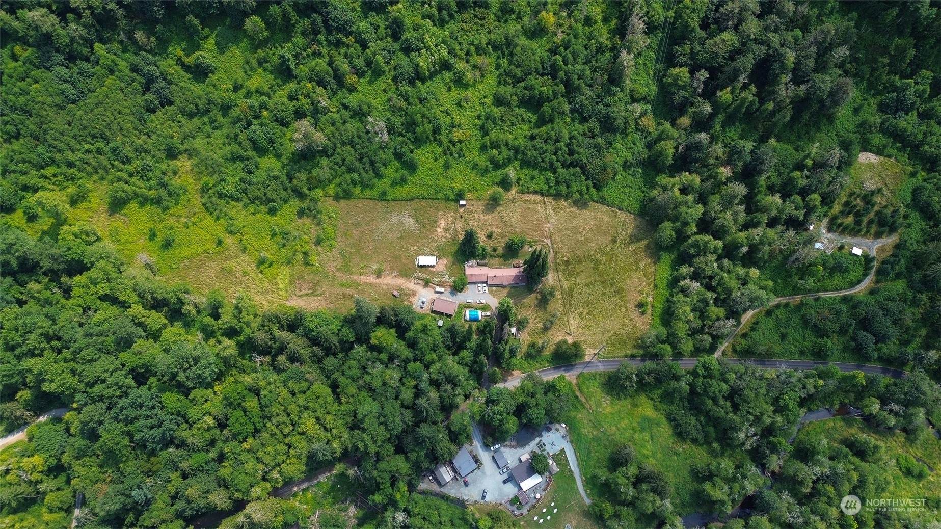 11120 Ohop Valley-Extension Road East Eatonville, WA 98328 - Photo 32 of 32 an aerial view of a house with a yard