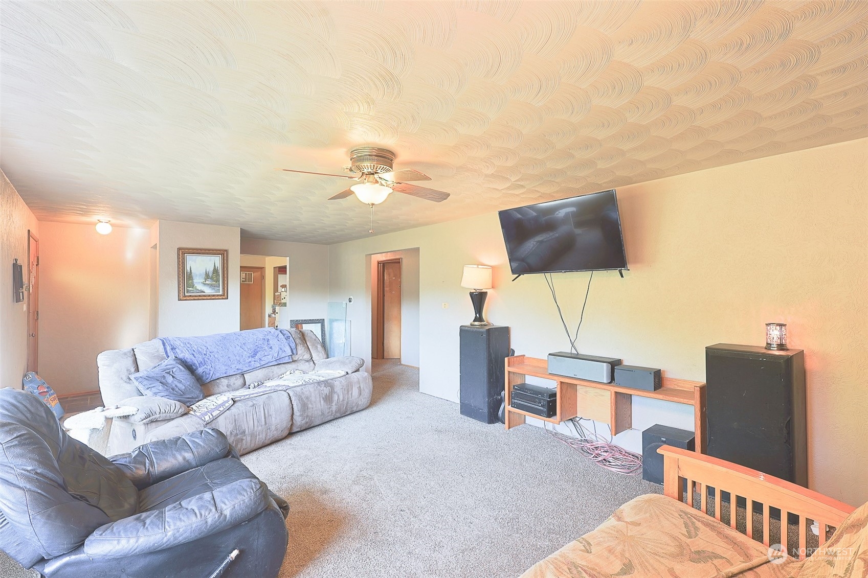 11120 Ohop Valley-Extension Road East Eatonville, WA 98328 - Photo 4 of 32 a living room with furniture and a flat screen tv