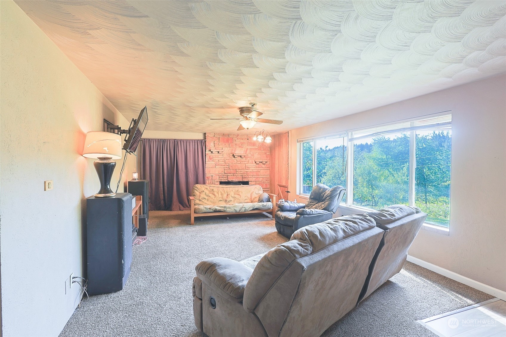 11120 Ohop Valley-Extension Road East Eatonville, WA 98328 - Photo 5 of 32 a living room with furniture and a large window