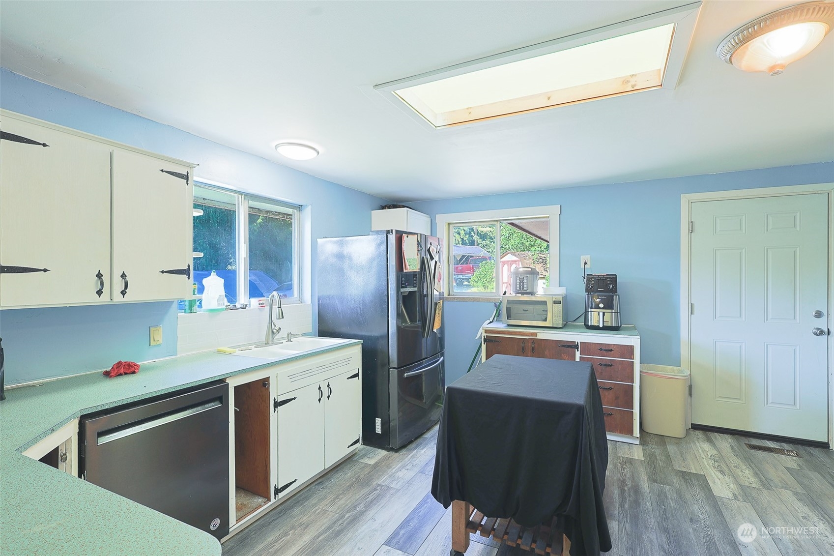 11120 Ohop Valley-Extension Road East Eatonville, WA 98328 - Photo 6 of 32 a kitchen with a sink appliances and cabinets