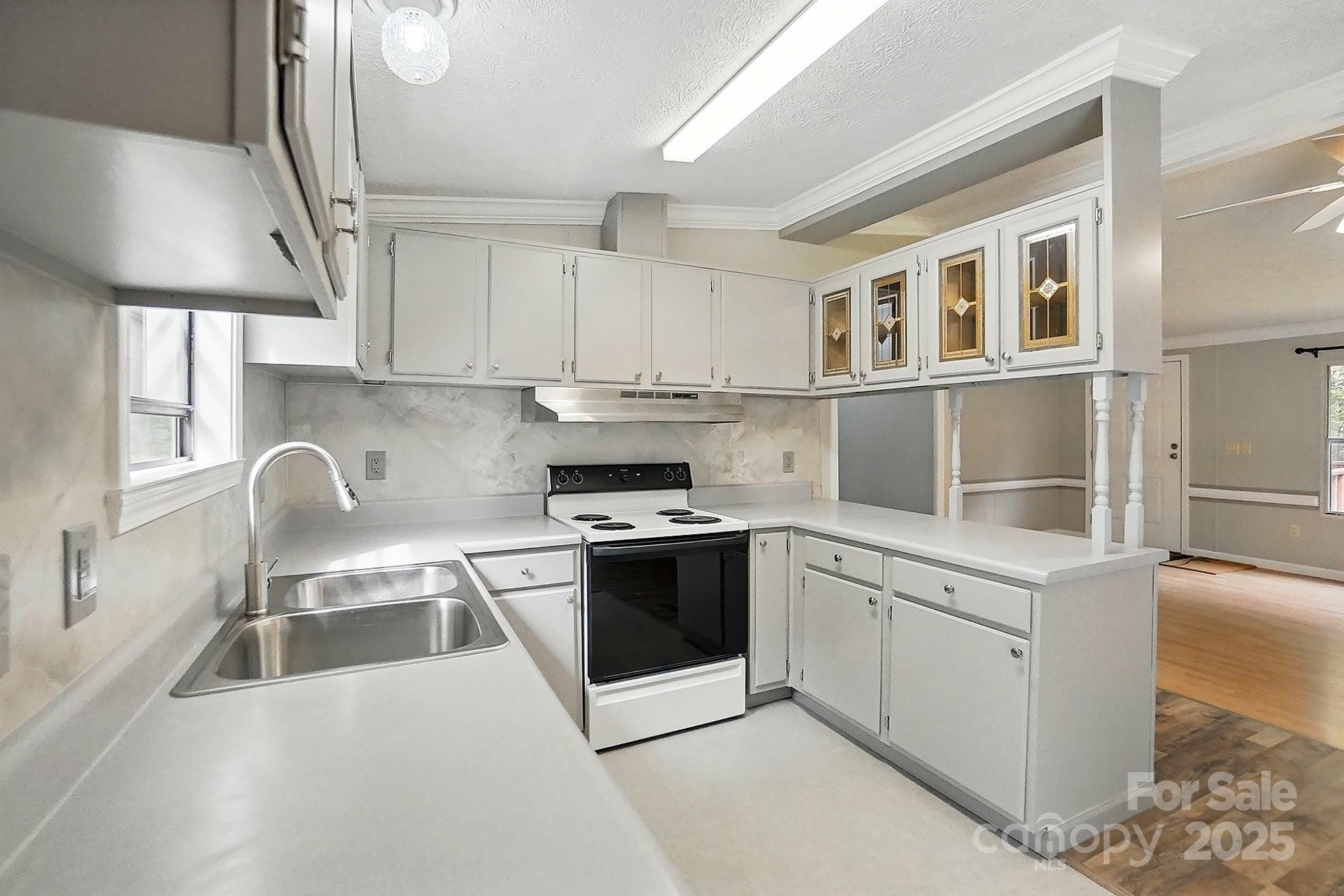 621 Harper Davis Road Lake Wylie, SC 29710 - Photo 11 of 30 a kitchen with stainless steel appliances granite countertop a stove a sink dishwasher and a refrigerator