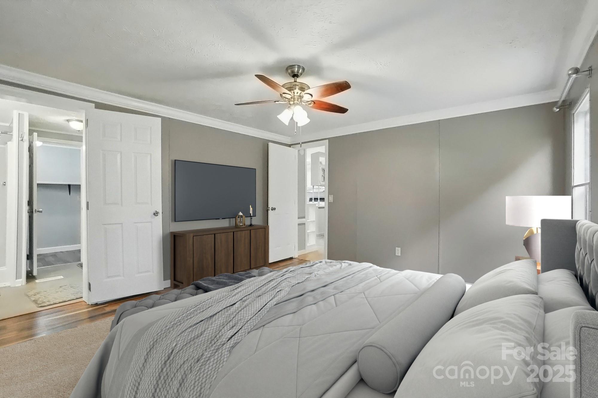 621 Harper Davis Road Lake Wylie, SC 29710 - Photo 14 of 30 a bedroom with a bed and a chandelier