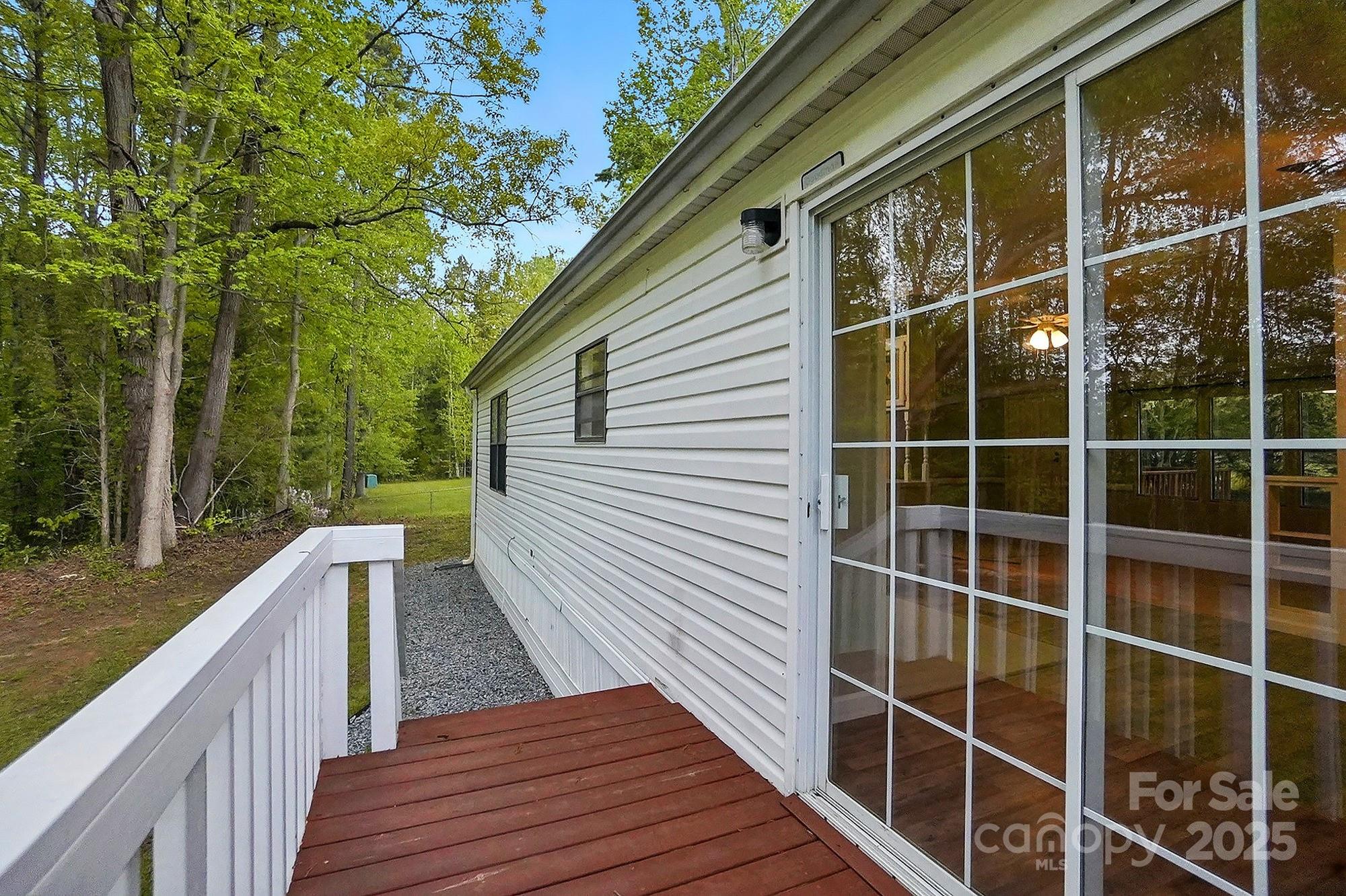 621 Harper Davis Road Lake Wylie, SC 29710 - Photo 30 of 30 a view of deck with wooden floor and fence and a floor to ceiling window