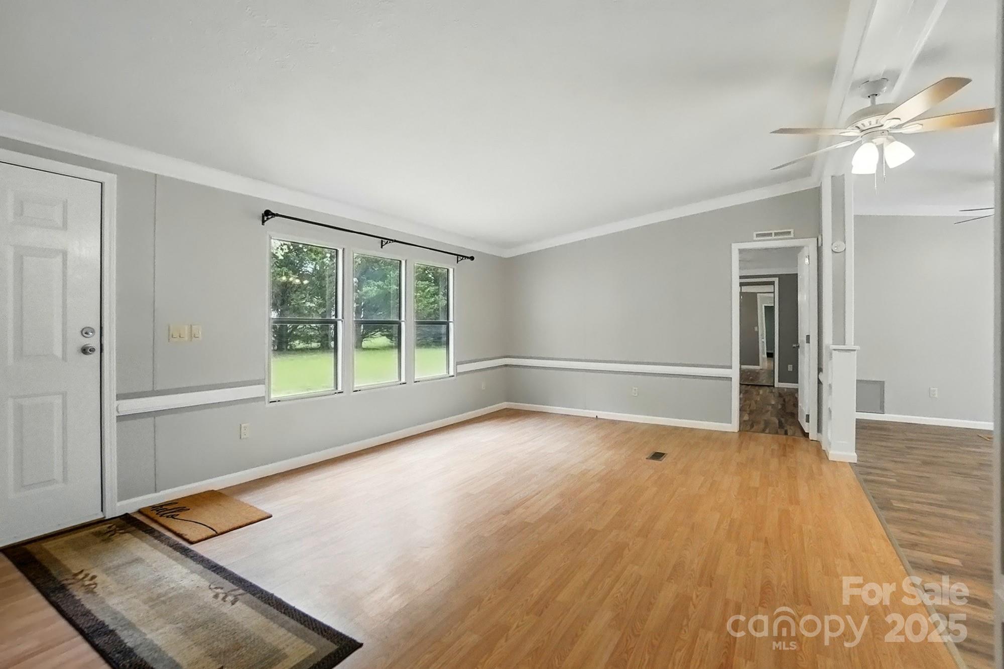 621 Harper Davis Road Lake Wylie, SC 29710 - Photo 5 of 30 wooden floor in an empty room with a window