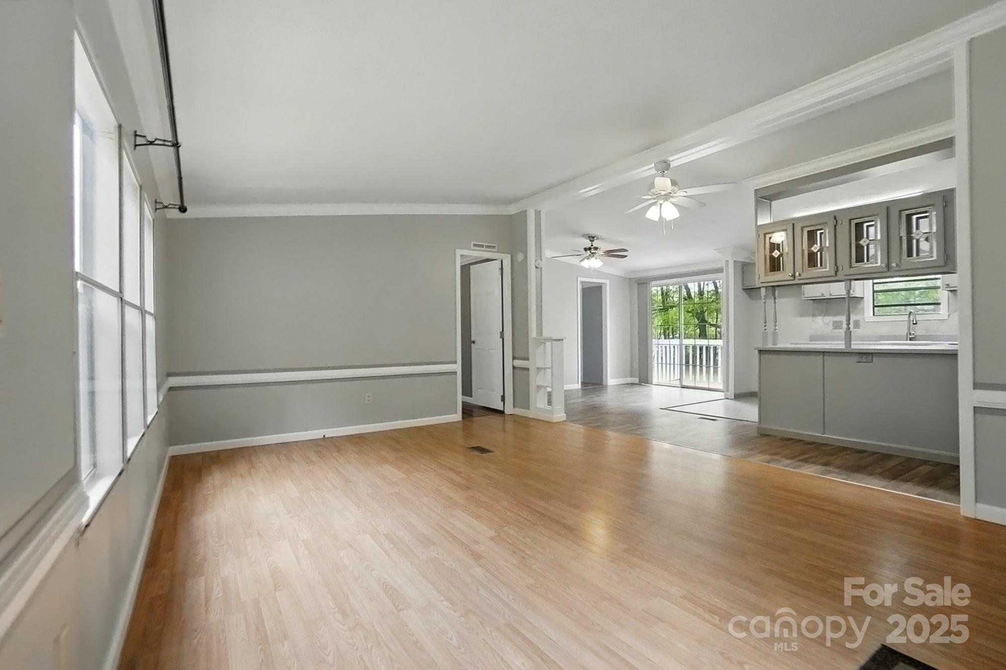 621 Harper Davis Road Lake Wylie, SC 29710 - Photo 6 of 30 wooden floor in an empty room with a window