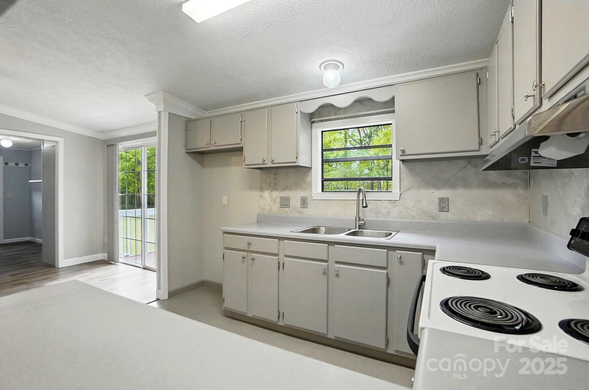 621 Harper Davis Road Lake Wylie, SC 29710 - Photo 9 of 30 a kitchen with sink a window and appliances