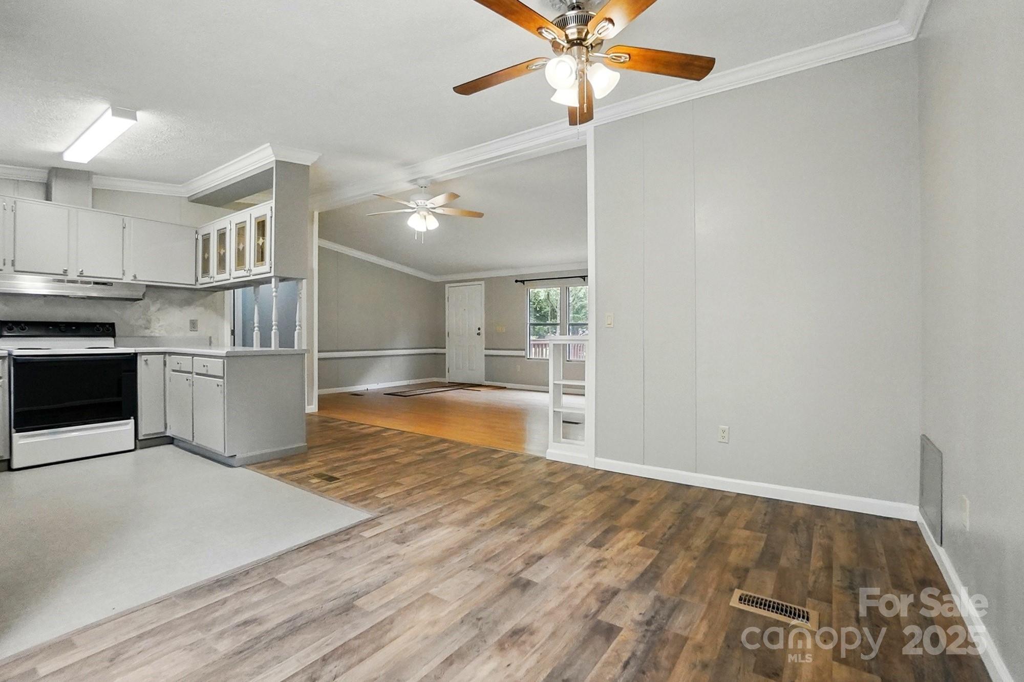 621 Harper Davis Road Lake Wylie, SC 29710 - Photo 10 of 30 a view of a kitchen with a stove cabinets and wooden floor