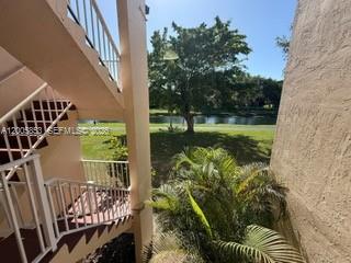 15285 Southwest 107th Lane, Unit 214 Miami, FL 33196 - Photo 15 of 16 a view of balcony with garden