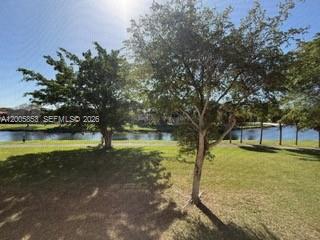 15285 Southwest 107th Lane, Unit 214 Miami, FL 33196 - Photo 16 of 16 a view of a yard with an outdoor space