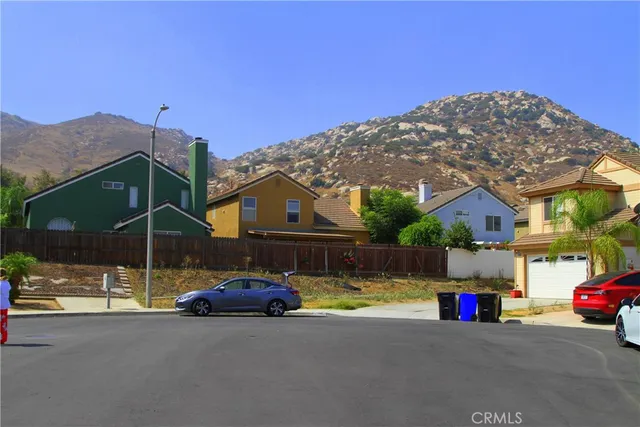 a view of a street in front of a house