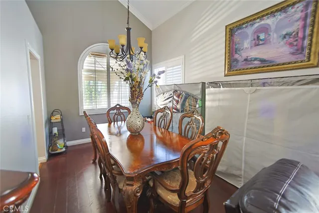 a dining room with furniture and wooden floor