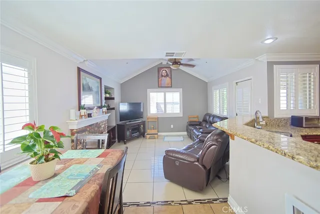 a living room with granite countertop furniture and fireplace