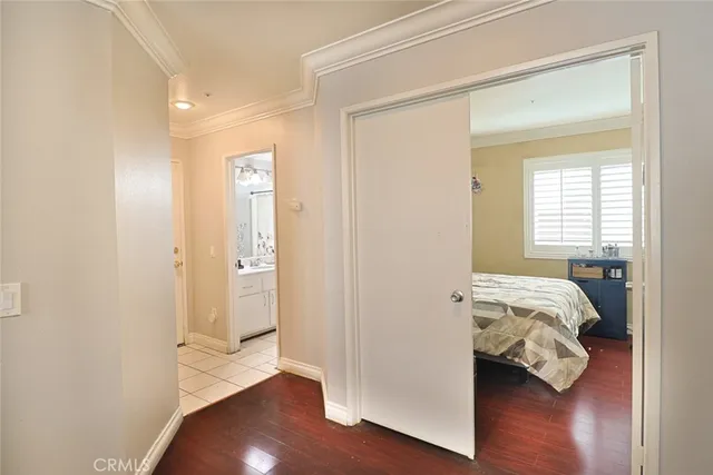 a view of bedroom with wooden floor