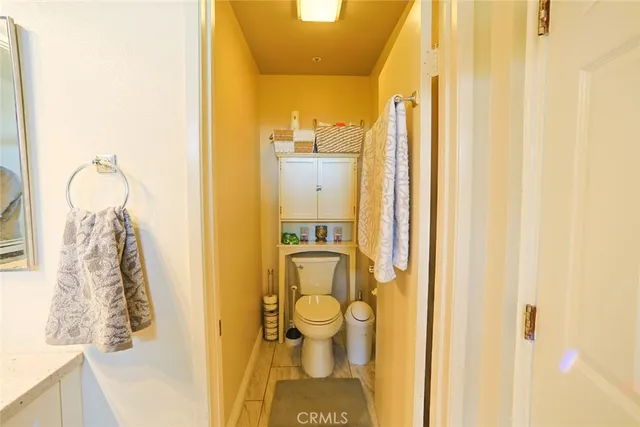 a spacious bedroom with furniture and a large window