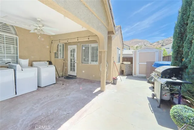 a view of the house with a yard