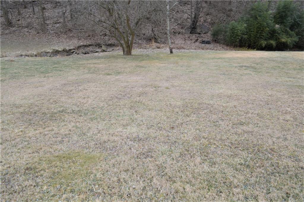 425 Quarry Road Washington, PA 15301 - Photo 1 of 4 a view of dirt field with trees in background