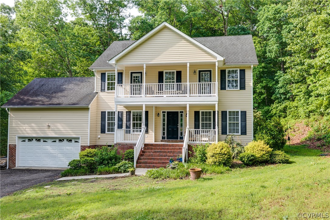 10970 Weybridge Road Chester, VA 23831 - Photo 1 of 35 a front view of a house with a yard and potted plants