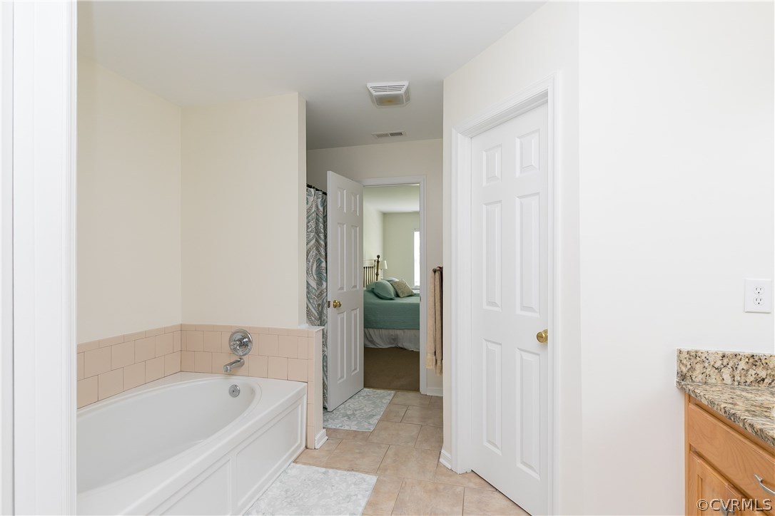 10970 Weybridge Road Chester, VA 23831 - Photo 11 of 35 a bathroom with a bathtub and a shower