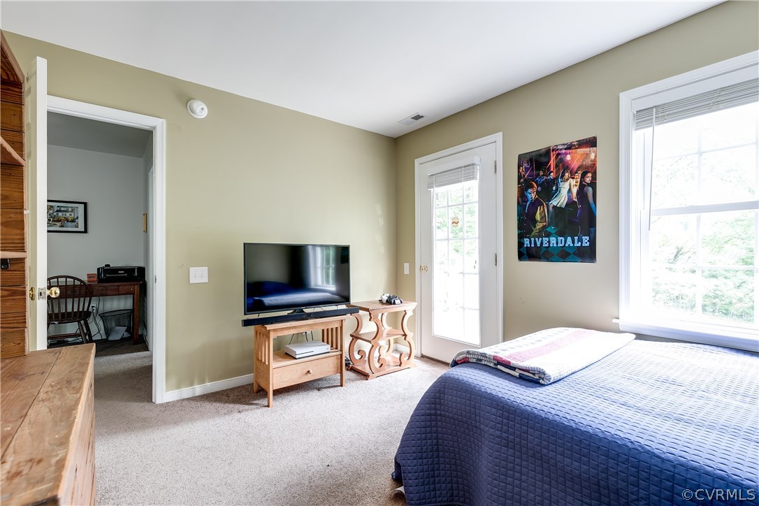 10970 Weybridge Road Chester, VA 23831 - Photo 13 of 35 a bedroom with a bed and a flat screen tv