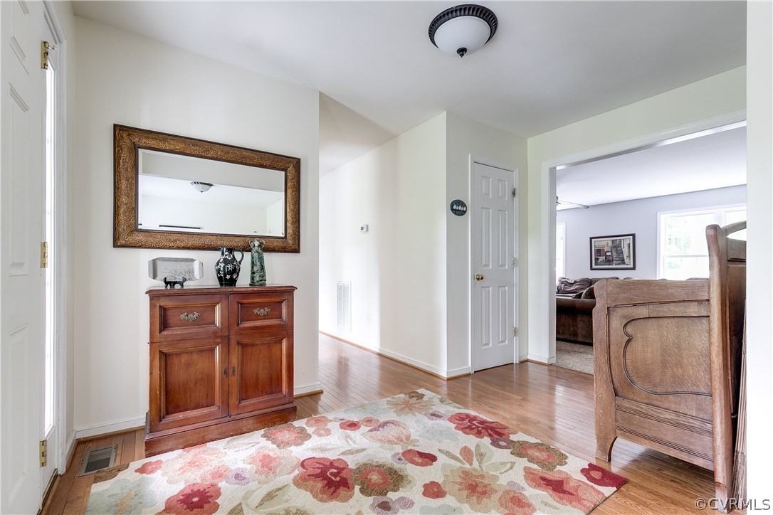 10970 Weybridge Road Chester, VA 23831 - Photo 18 of 35 a bedroom with a bed and wooden floor