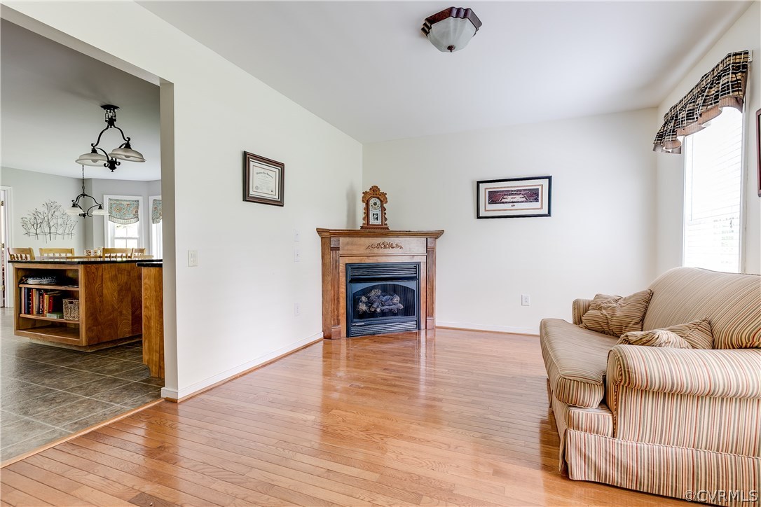 10970 Weybridge Road Chester, VA 23831 - Photo 22 of 35 a living room with furniture and a fireplace