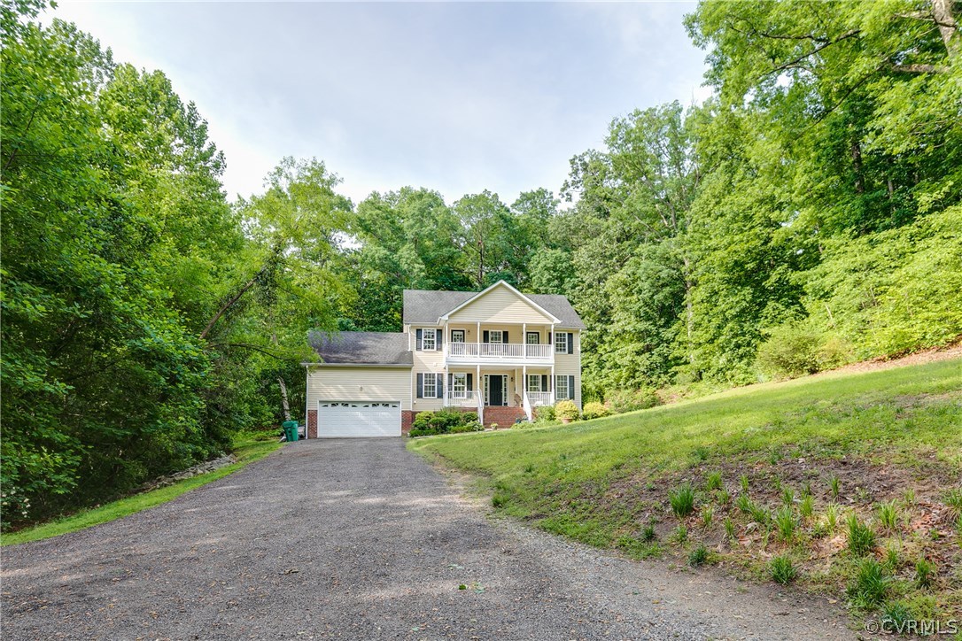 10970 Weybridge Road Chester, VA 23831 - Photo 34 of 35 a front view of a house with a yard and trees