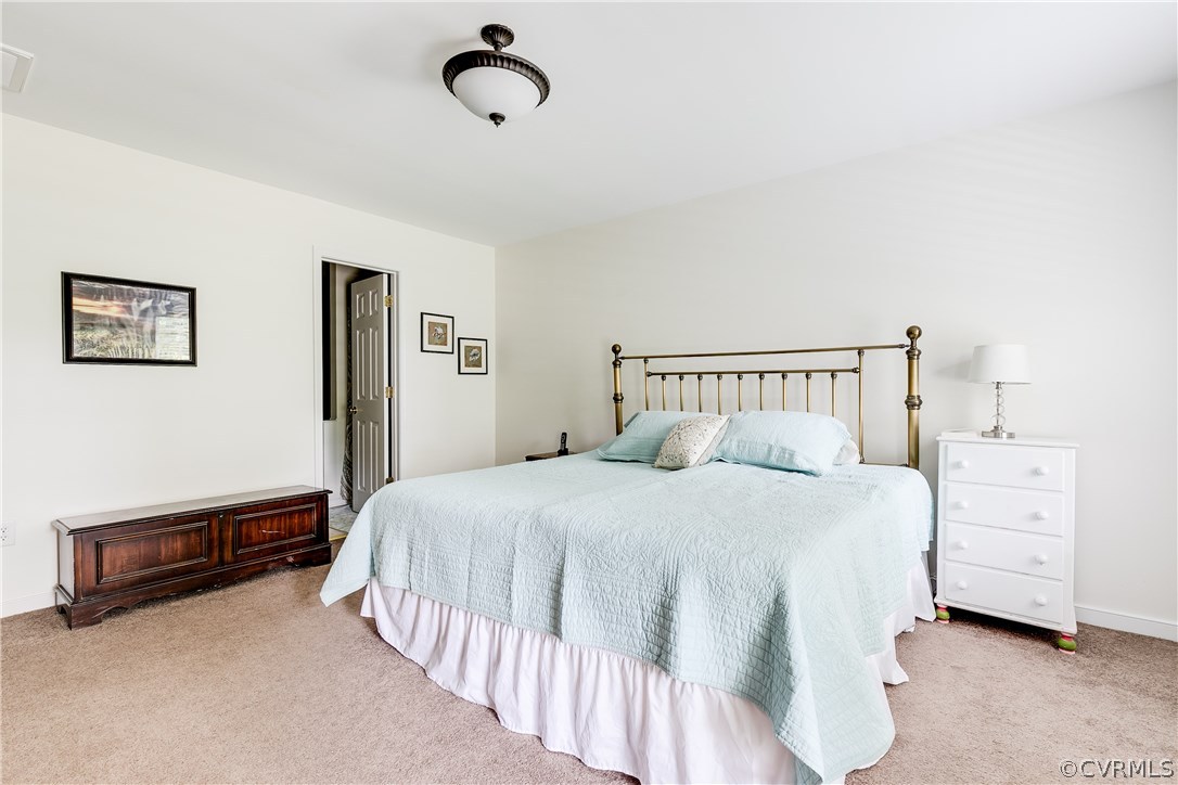 10970 Weybridge Road Chester, VA 23831 - Photo 7 of 35 a bedroom with a bed and cabinets