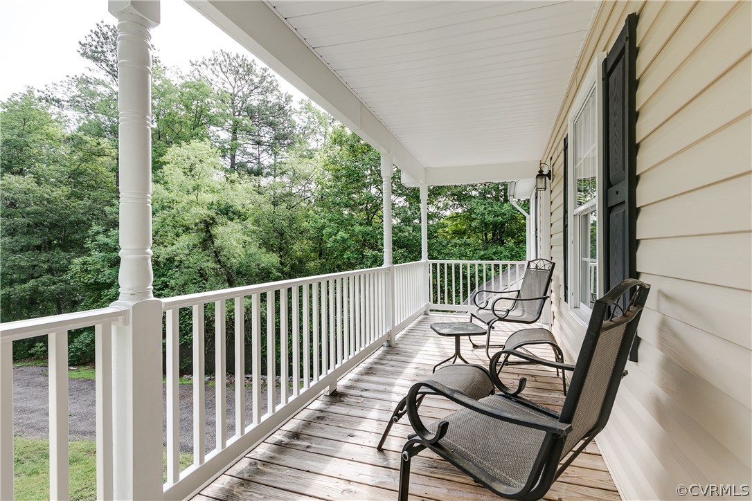 10970 Weybridge Road Chester, VA 23831 - Photo 8 of 35 a view of a chair and tables in the balcony