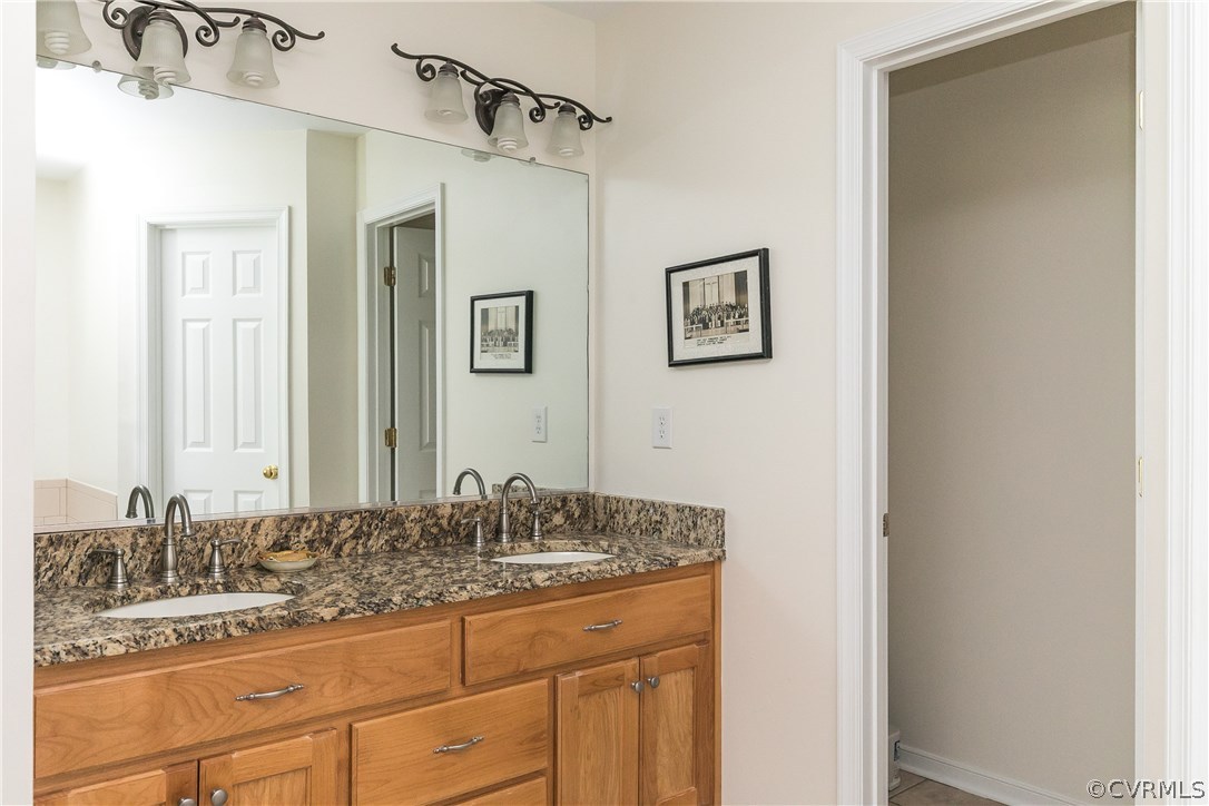 10970 Weybridge Road Chester, VA 23831 - Photo 10 of 35 a bathroom with a sink and a mirror