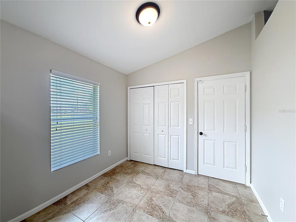 6358 Southwest 155th Place Ocala, FL 34473 - Photo 13 of 55 an empty room with windows and closet