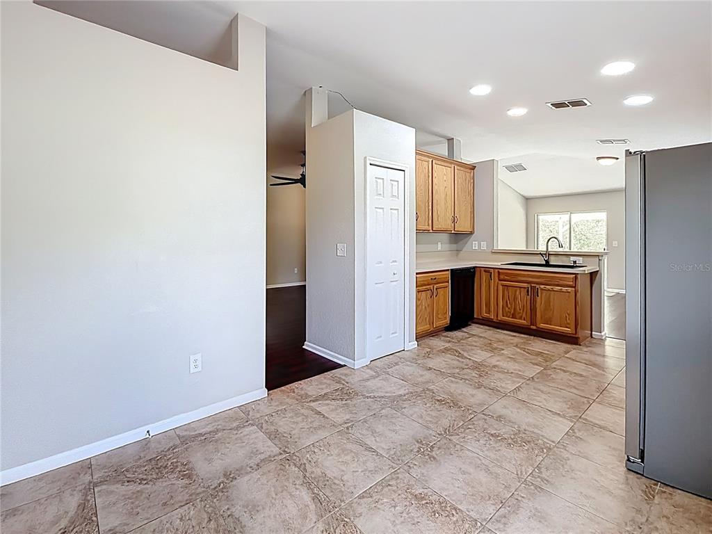 6358 Southwest 155th Place Ocala, FL 34473 - Photo 16 of 55 a large kitchen with stainless steel appliances granite countertop a refrigerator and a sink